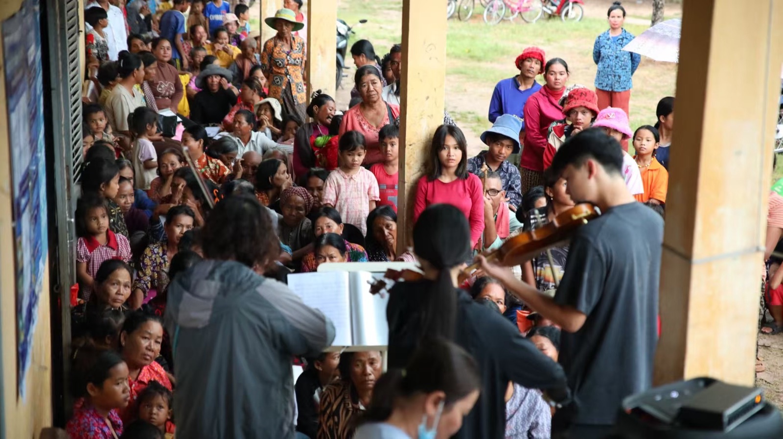 Sharing music during the visit to Cambodia